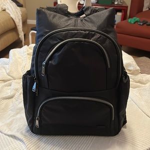 LUG black hatchback backpack with the gold heart pattern inside